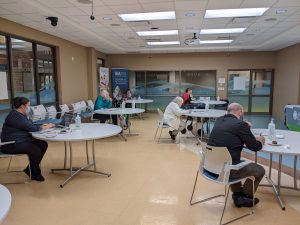 Judging event with contest judges sitting at individual tables