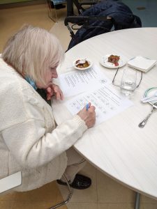 Charlotte Graham, resident judge, judging a dish