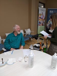 Phil Fiess, resident judge, chatting with event organizer, Holly Hebner